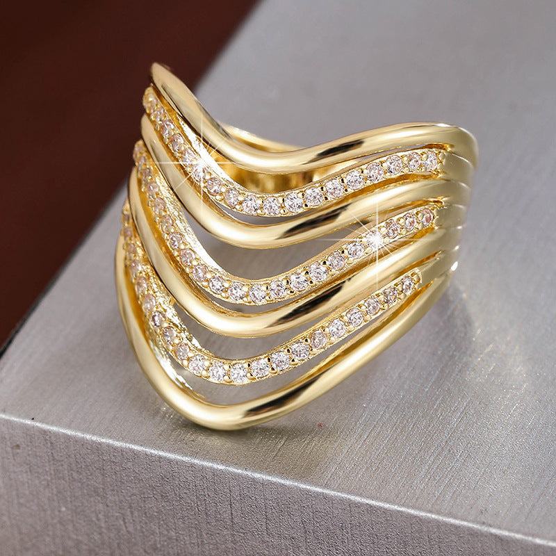 Gold geometric hollow zircon stackable ring with irregular patterns and zircon accents